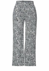 Pantalons larges noir et blanc avec une taille élastique, présentant un motif géométrique de triangles de tailles et orientations variées.