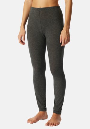 Grå leggings gjorda av mjukt, elastiskt tyg. De har en åtsittande design och ett elastiskt midjeband, vilket ger en slät textur och en elegant look.