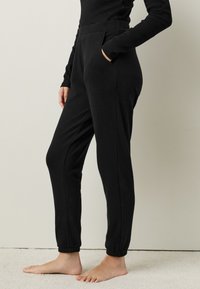 Next REGULAR FIT  - Pantalones deportivos - black