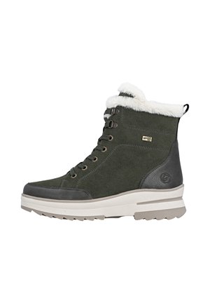 Green suede ankle boot with faux fur collar, grey leather accents, round toe, and a chunky white and grey sole. Features metal eyelets and laces.