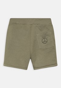 Bermudas de algodão caqui com uma textura suave, cintura elástica e um bolso traseiro com um gráfico de símbolo de paz.