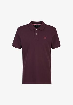 Donkerpaarse polo met korte mouwen, twee knopen en een klein geborduurd schildlogo op de linkerborst.