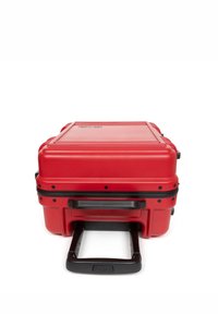 Red hard-shell suitcase with a textured surface, black accents, a retractable handle, and reinforced corners.  Compact design for travel.