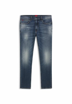 Jeans i denim med en blekt mörkblå tvätt, med slitna partier, klassisk fem fickor-design och rak benpassform. Röd etikettdetalj.