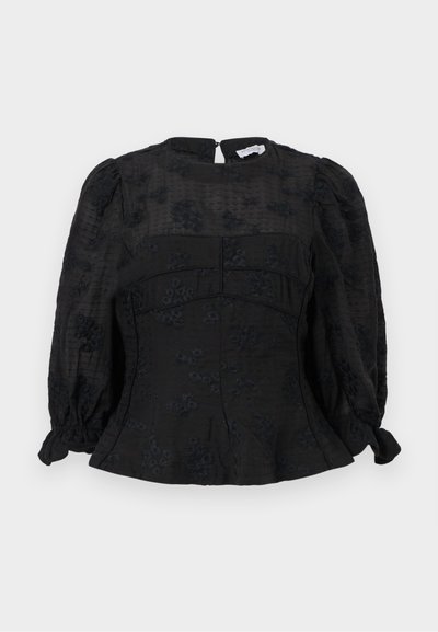 Μαύρο μπλουζάκι με μακριά μανίκια και διακριτικά λουλουδάτα μοτίβα, με φουσκωτούς ώμους, εφαρμοστή μέση και φερμουάρ στο πίσω μέρος.
