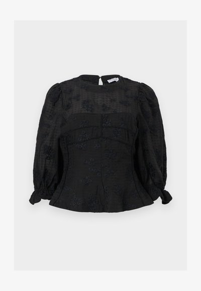 Μαύρο μπλουζάκι με μακριά μανίκια και διακριτικά λουλουδάτα μοτίβα, με φουσκωτούς ώμους, εφαρμοστή μέση και φερμουάρ στο πίσω μέρος.
