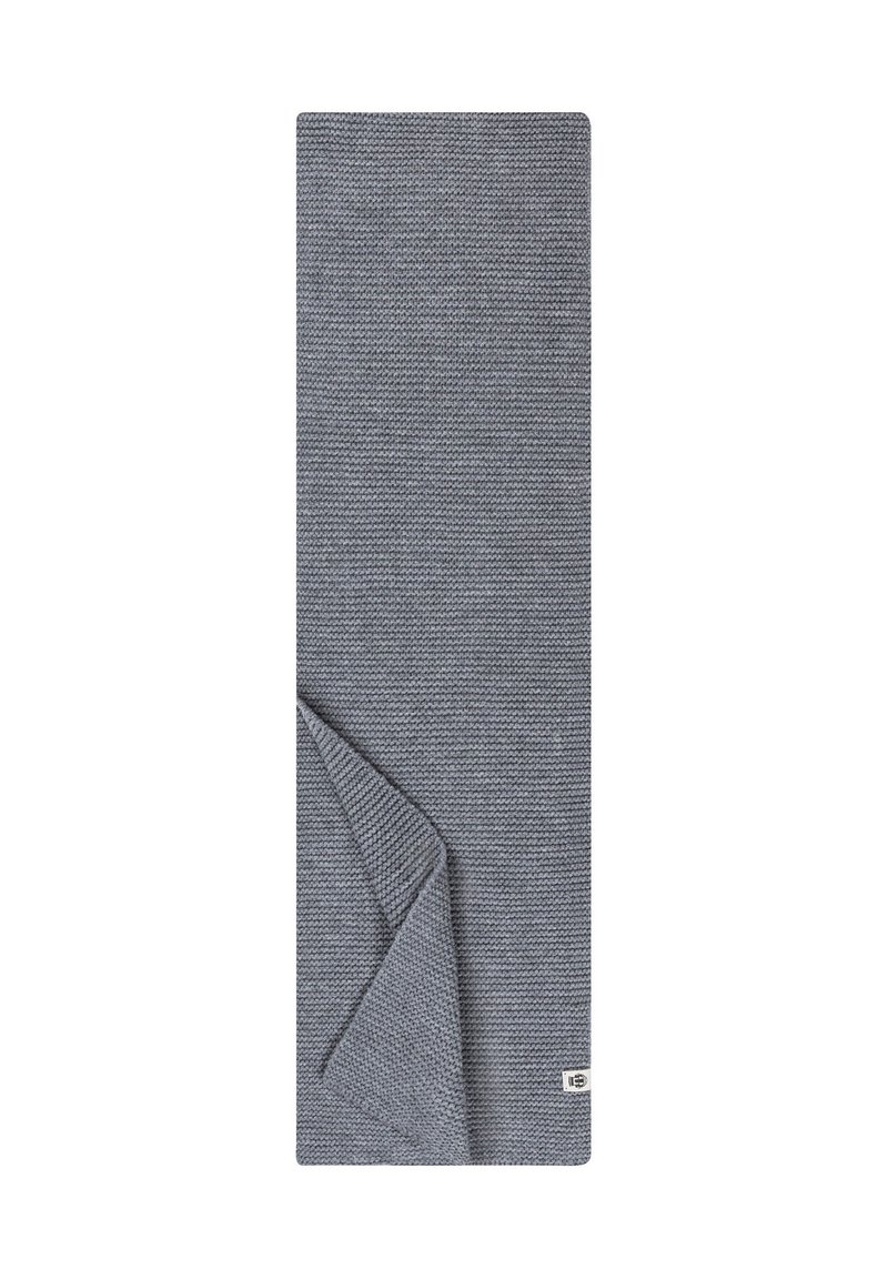 Grau gewebte Decke mit einem strukturierten Muster, gefaltete Ecke, die eine glatte Unterseite und ein kleines Etikett in der unteren rechten Ecke zeigt.