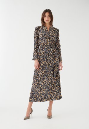 Abito a fiori con maniche lunghe, scollo a V e cintura in vita. Caratterizzato da una base beige con motivi blu navy e marroni. Completato da un design fluido.