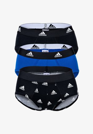 Trois slips pour homme, noirs et bleus, avec des ceintures élastiques arborant le logo Adidas en répétition. Tissu en coton avec une finition lisse.