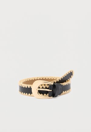 Black leather belt with beige stitched edges and a large shiny gold buckle, rolled against a white background.