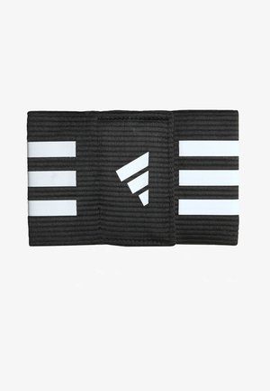 Black elastic band with three white stripes and a triangular logo. Textured surface, rectangular shape, suitable for athletic use.