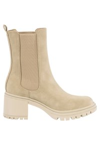 Bottine beige en daim avec panneaux latéraux élastiques, talon bloc épais, languette à l’arrière et semelle cramponnée pour une bonne accroche.