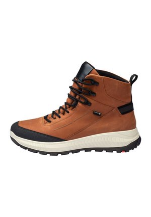 Braune Leder-Wanderschuhe mit einer schwarzen Gummischutzkappe, hohem Knöchelschutz und schwarzen Schnürsenkeln. Mit einer strukturierten Sohle für besseren Halt.