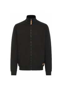 Black zip-up jacket with a high collar, made from a soft fabric. Features side pockets and a small tan brand tag on the hem.