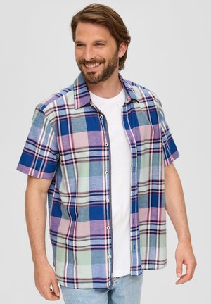 Short-sleeve plaid shirt featuring blue, pink, and green squares, with a button-up front and collar, layered over a white t-shirt.