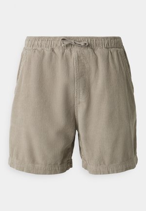 Shorts beiges en tissu côtelé, dotés d'une taille élastique avec cordon de serrage, et d'une coupe droite avec des ourlets retournés.