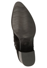 Black suede ankle boot with a textured rubber sole, rounded toe, and a low heel. Features zipper detail on the side.