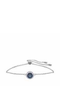 Bracelet en argent avec une chaîne ajustable, arborant une pierre ronde bleu foncé entourée d'accents de pierres claires.