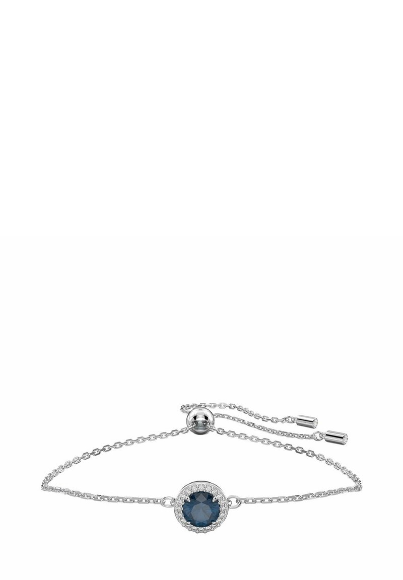 Bracelet en argent avec une chaîne ajustable, arborant une pierre ronde bleu foncé entourée d'accents de pierres claires.