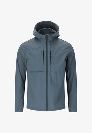 Lichte, gevoerde jas in leisteengrijs. Voorzien van twee borstzakken, een ritssluiting aan de voorkant en elastische manchetten. Textuur, waterafstotend materiaal.