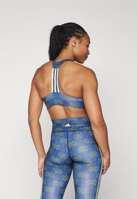 adidas Performance ADIDAS FARM RIO MEDIUM-SUPPORT - Reggiseno sportivo con sostegno medio - night indigo/dark marine/cream white