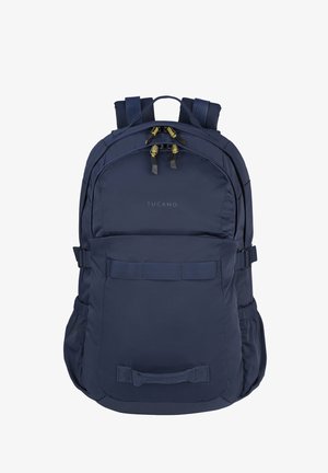 Navy blue Tucano backpack with two zippered compartments, padded shoulder straps, side pockets, and front carrying handles.