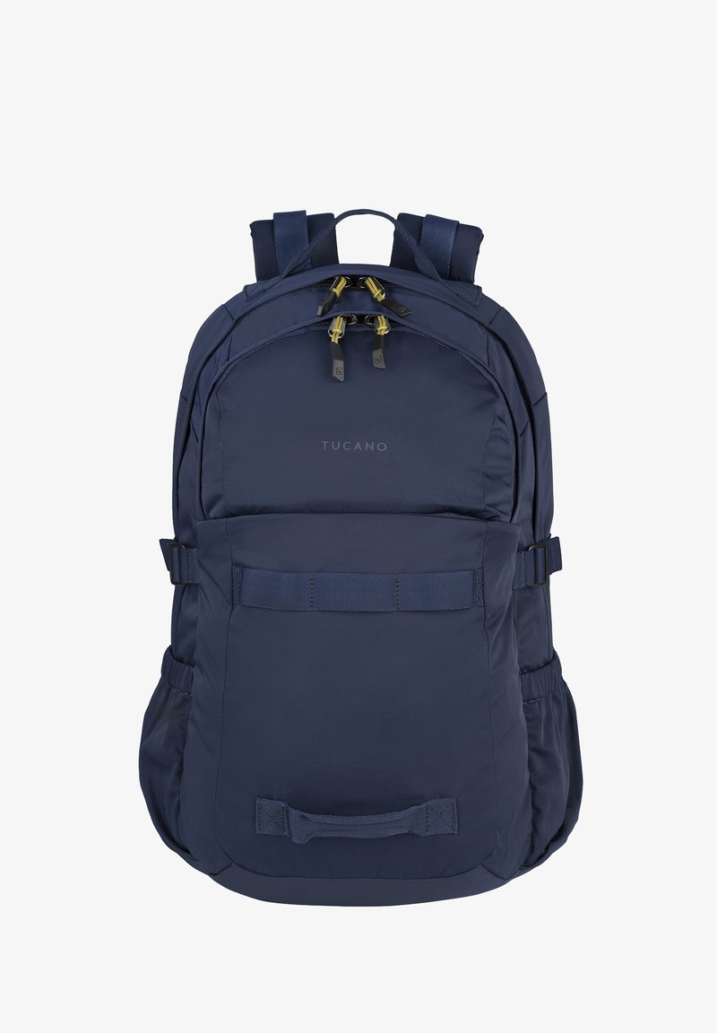 Zaino Tucano blu navy con due scomparti con cerniera, spallacci imbottiti, tasche laterali e maniglie anteriori per il trasporto.