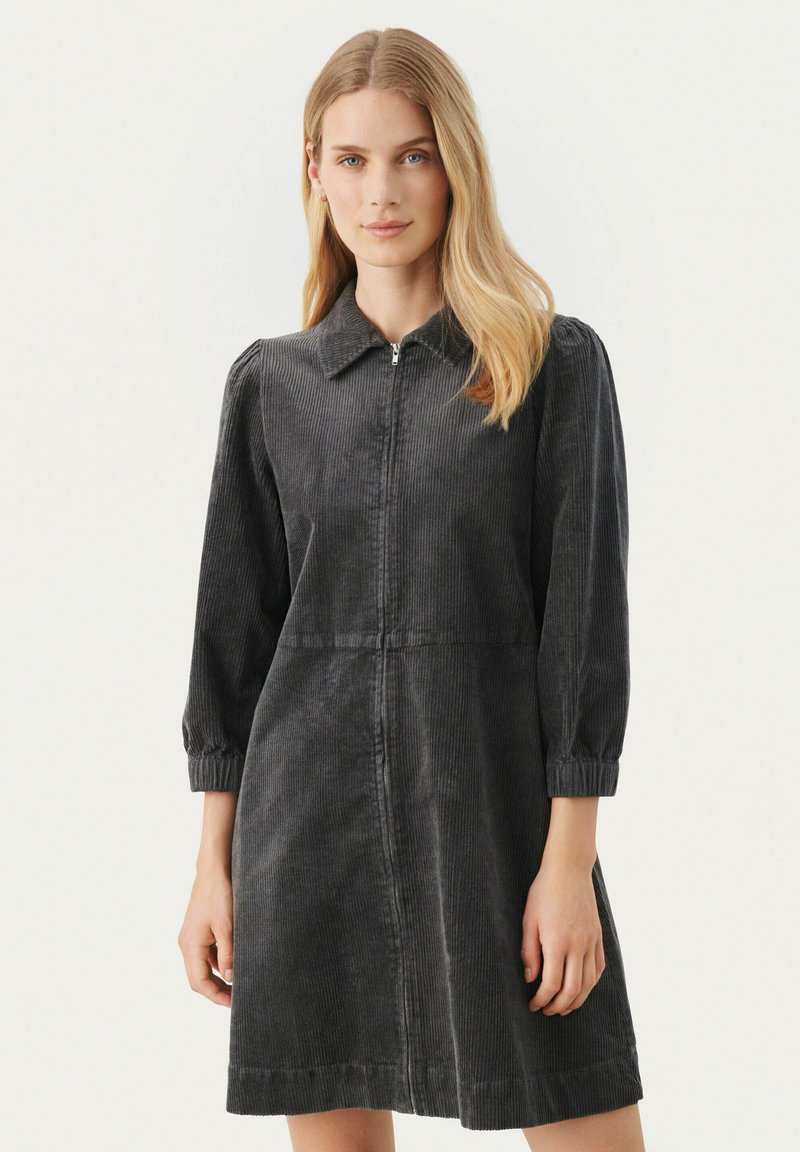 Dunkelgraues Cordrouykleid mit kragenlosem Ausschnitt, langen Puffärmeln, Frontreißverschluss und einer taillierten Taille mit schwingendem Rock.