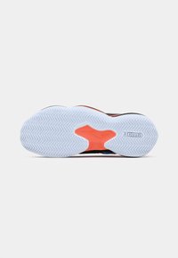 Shoe sole with a predominantly white rubber base, featuring a herringbone pattern, black and orange accents, and a brand logo.