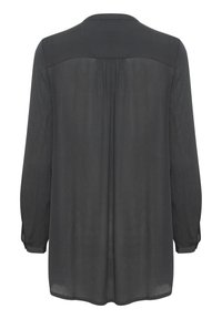 Blusa a maniche lunghe, grigia scura con una texture liscia, chiusura a bottoni sui polsini e dettaglio plissettato sul retro. Orlo arrotondato. Tessuto non trasparente.