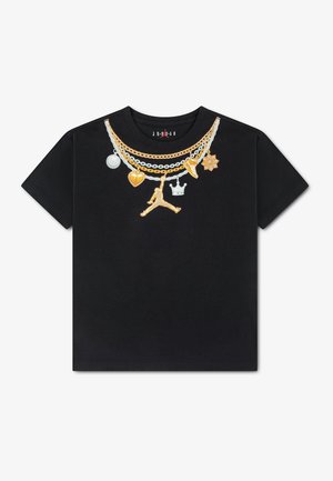 Black short-sleeve t-shirt with printed designs of layered gold and silver chains featuring a basketball, heart, crown, sneaker, and flower charms.