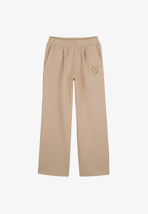 Beige wide-leg pants made of soft fabric, featuring an elastic waistband, side pockets, and a circular logo accent on the front.