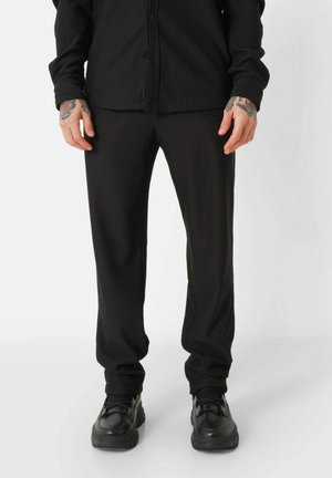 TEXTURED - Trousers - black