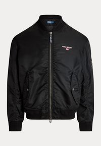 Svart bomberjacka i släta nylon, med dragkedja fram, två sidfickor, ribbade ärmmuddar och broderade logodetaljer.