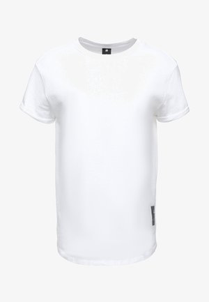 T-shirt en coton blanc avec un col rond, des manches courtes, une coupe droite et une petite étiquette noire sur le côté inférieur. Pas de motifs ni d'accents.