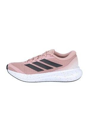 Zapatilla de correr rosa con rayas negras, suela gruesa blanca con motas, parte superior de malla y diseño de cordones vista de lado.
