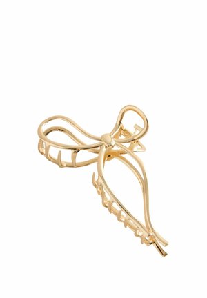 Haarklammer aus Goldmetall in Form einer abstrakten Schleife mit offenem, gebogenem Design und ineinandergreifenden Zähnen zum Befestigen der Haare.