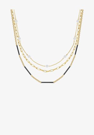 Collana a più strati in tono oro con diverse stile di catene, piccoli accenti neri e perle bianche sparse. Varie texture e lunghezze.
