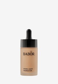 Babor Hydra Liquid Foundation i en frostad glasflaska med en svart dropparkork, med svart text som märker produkten.