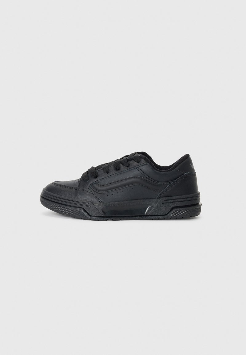 Black sneakers with a smooth leather upper, perforated details, round toe, and a textured rubber sole. Features black laces and subtle accents.