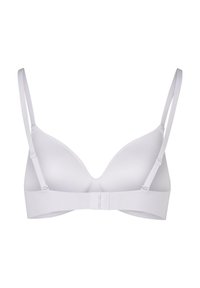White wireless bra with padded cups, adjustable straps, and a smooth texture. Features a hook-and-eye back closure for a secure fit.