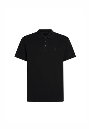 Polo shirt noir en coton. Équipé d'un plastron à trois boutons, de manches courtes et d'un petit logo noir sur la poitrine gauche.