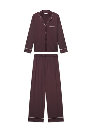 Top del pigiama viola scuro a maniche lunghe con bottoni e pantaloni a gamba larga abbinati con piping bianco lungo i bordi e i polsini, stesi su sfondo bianco.