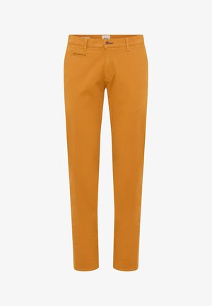 Schmal geschnittene Baumwollhosen in senfgelb. Mit einem normalen Bund, Fronttaschen und einer einzelnen Reißverschlusstasche an der Seite.