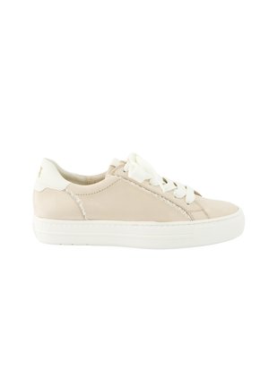 Beige low-top sneaker with white sole and laces, featuring subtle ruffle detail along side stitching and cream heel tab.