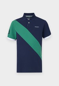 Marineblå polo med grønn skrå stripe, to knapper ved kragen og hvite mansjetter. Har Hackett-logo på brystet. Myk tekstur.