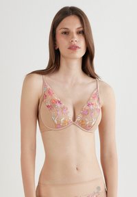 Lichtbeige bh met bloemenborduurwerk in roze, oranje en blauw. Zachte mesh cups met een diepe halslijn en verstelbare banden.
