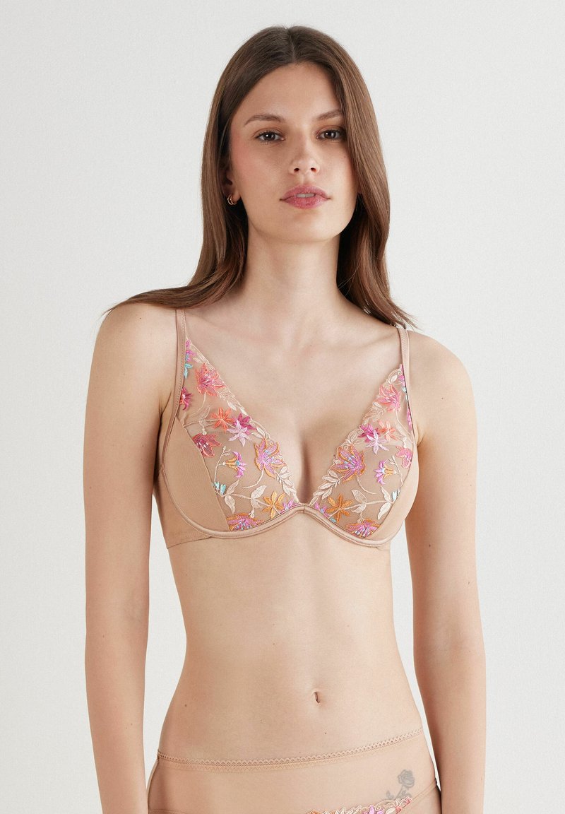Lichtbeige bh met bloemenborduurwerk in roze, oranje en blauw. Zachte mesh cups met een diepe halslijn en verstelbare banden.