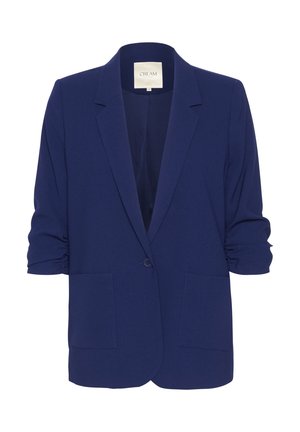 Námorně modrý blazer vyrobený z texturované tkaniny, s jednokotou závěrem, klopovým límcem a dvěma předními kapsami. Rukávy jsou stažené.