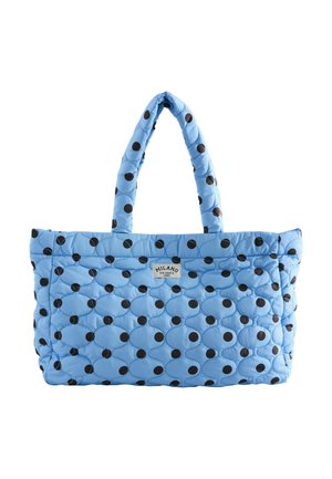 Light blue quilted tote bag with black polka dots and double handles, featuring a small "Milano Via Dante 1982" label on front.